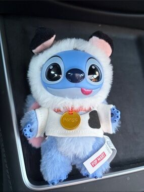 Blue Plush Character Doll with White Hoodie and Gold Tag